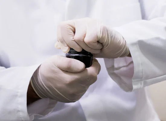 Two Hands Manually screwing together a jar